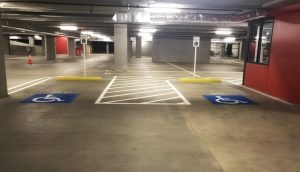 clean handicap spaces in parking garage after sweeping