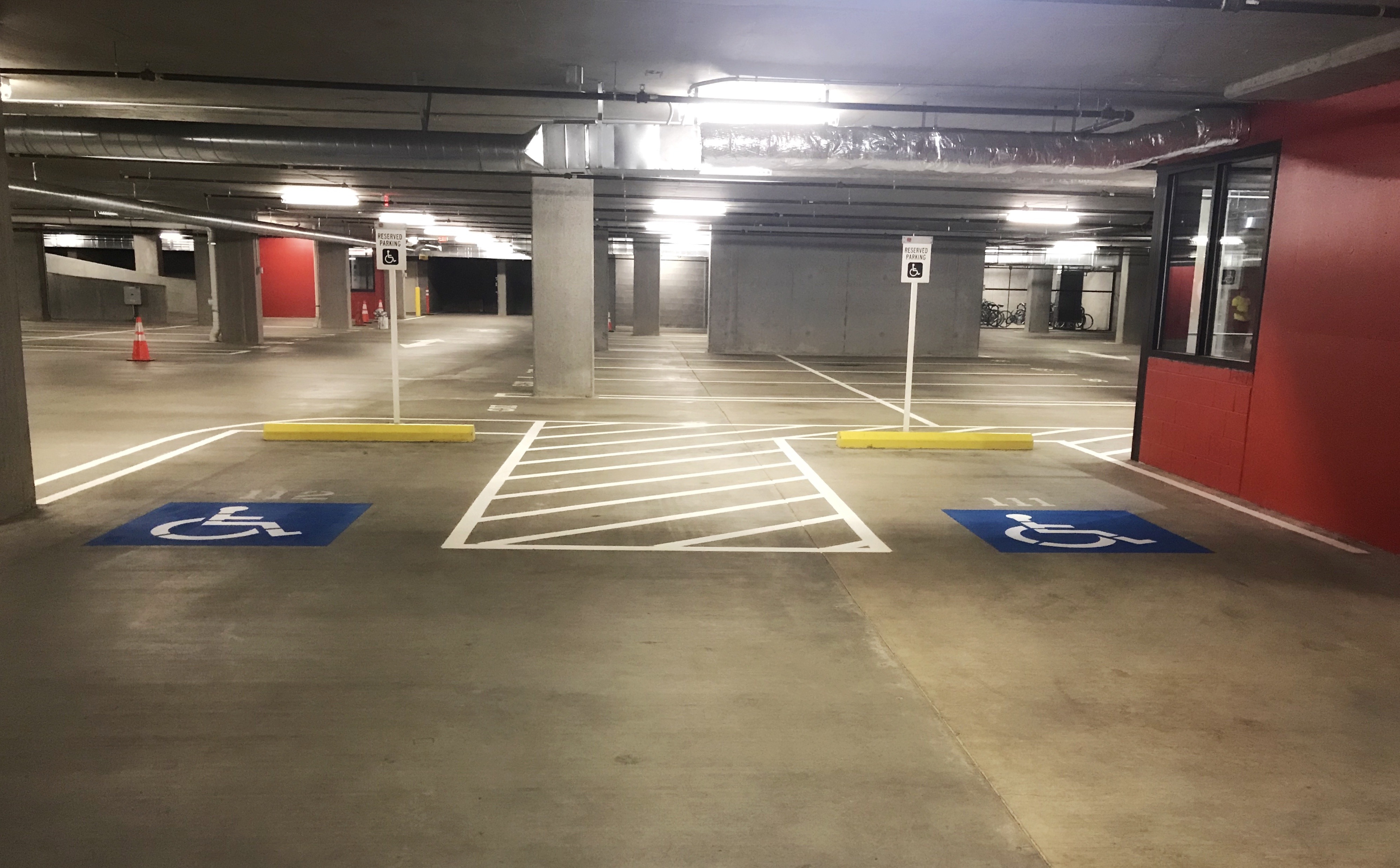 clean handicap spaces in parking garage after sweeping