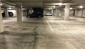 dirty parking garage before sweeping