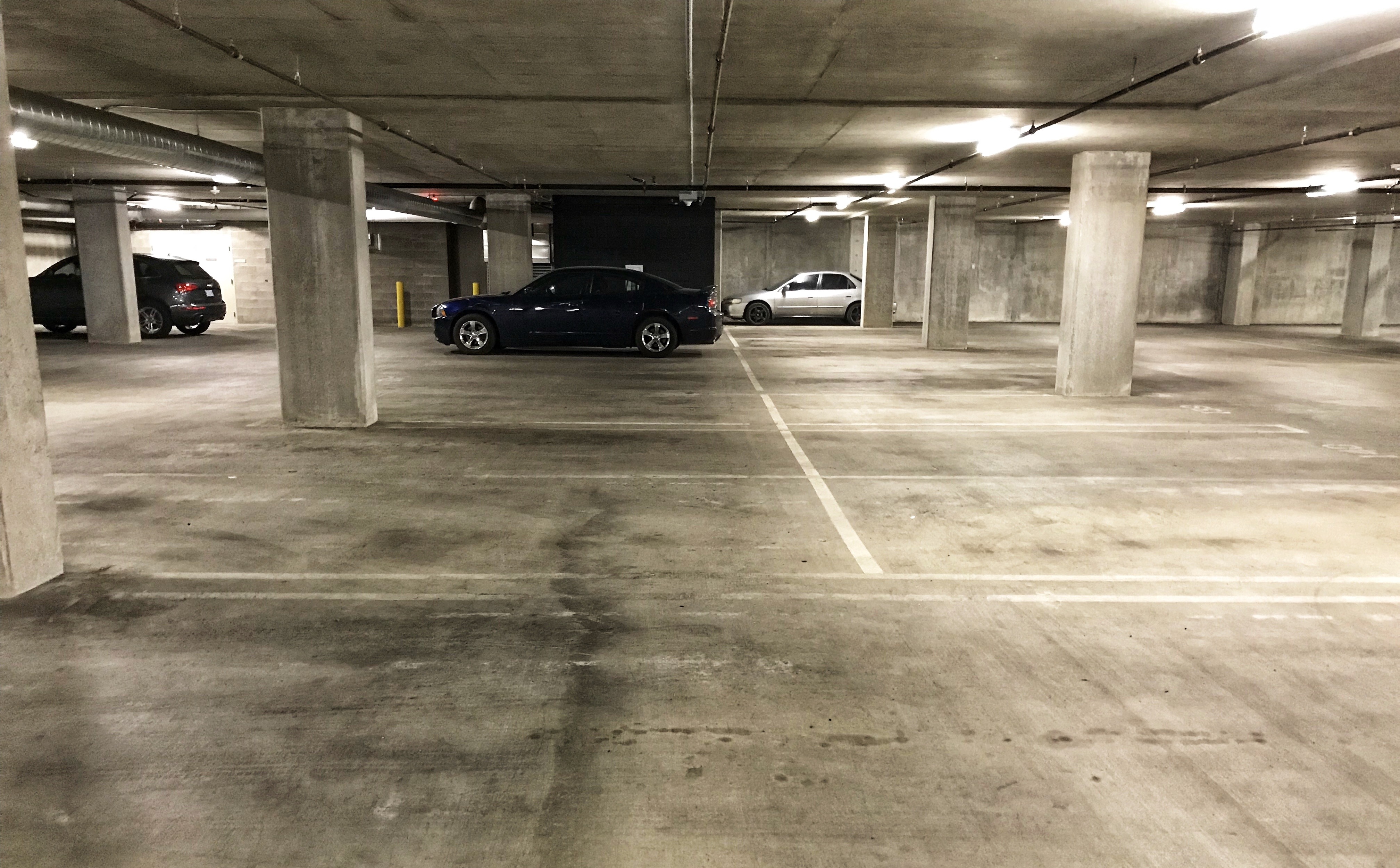 dirty parking garage before sweeping